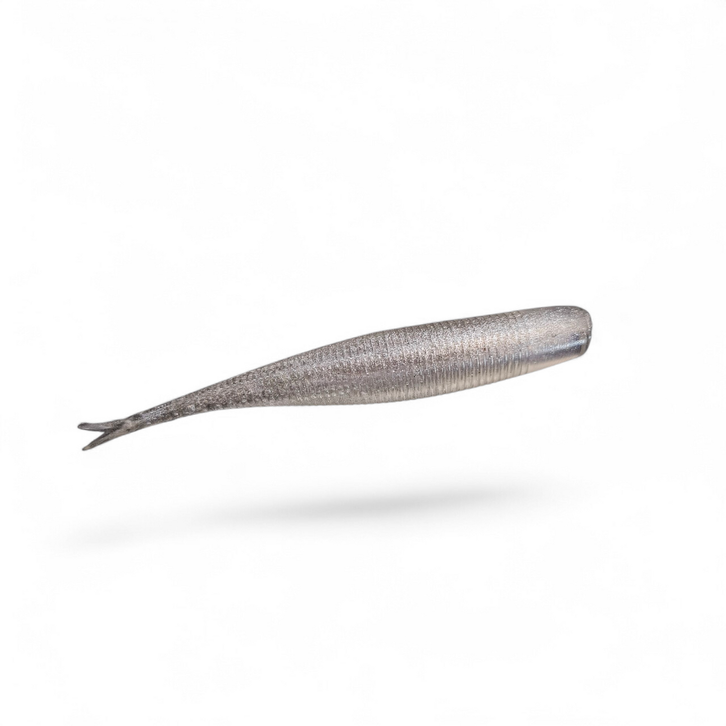 Limestone Softbaits 3.2-inch Tac Shad finesse bait with detailed body and tail for fishing lure, shown in an outdoor setting.