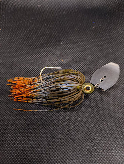 Limestone Softbaits ShadShaker chatter bait with green and black jig head and curly tail soft plastic for fishing.