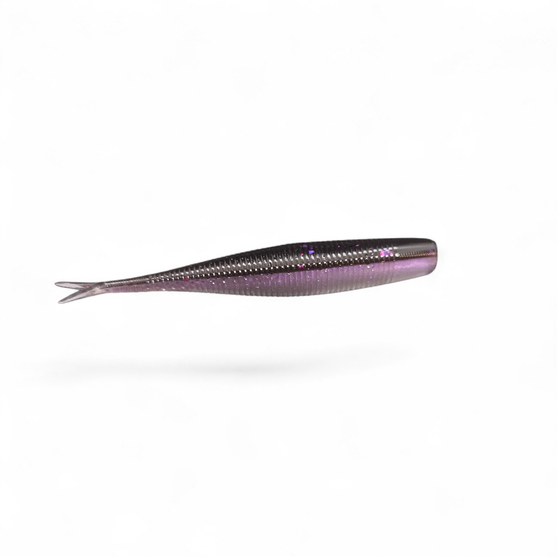 Limestone Softbaits 3.2-inch Tac Shad finesse bait in vibrant colors, designed for fishing and showcasing realistic fish-like features.