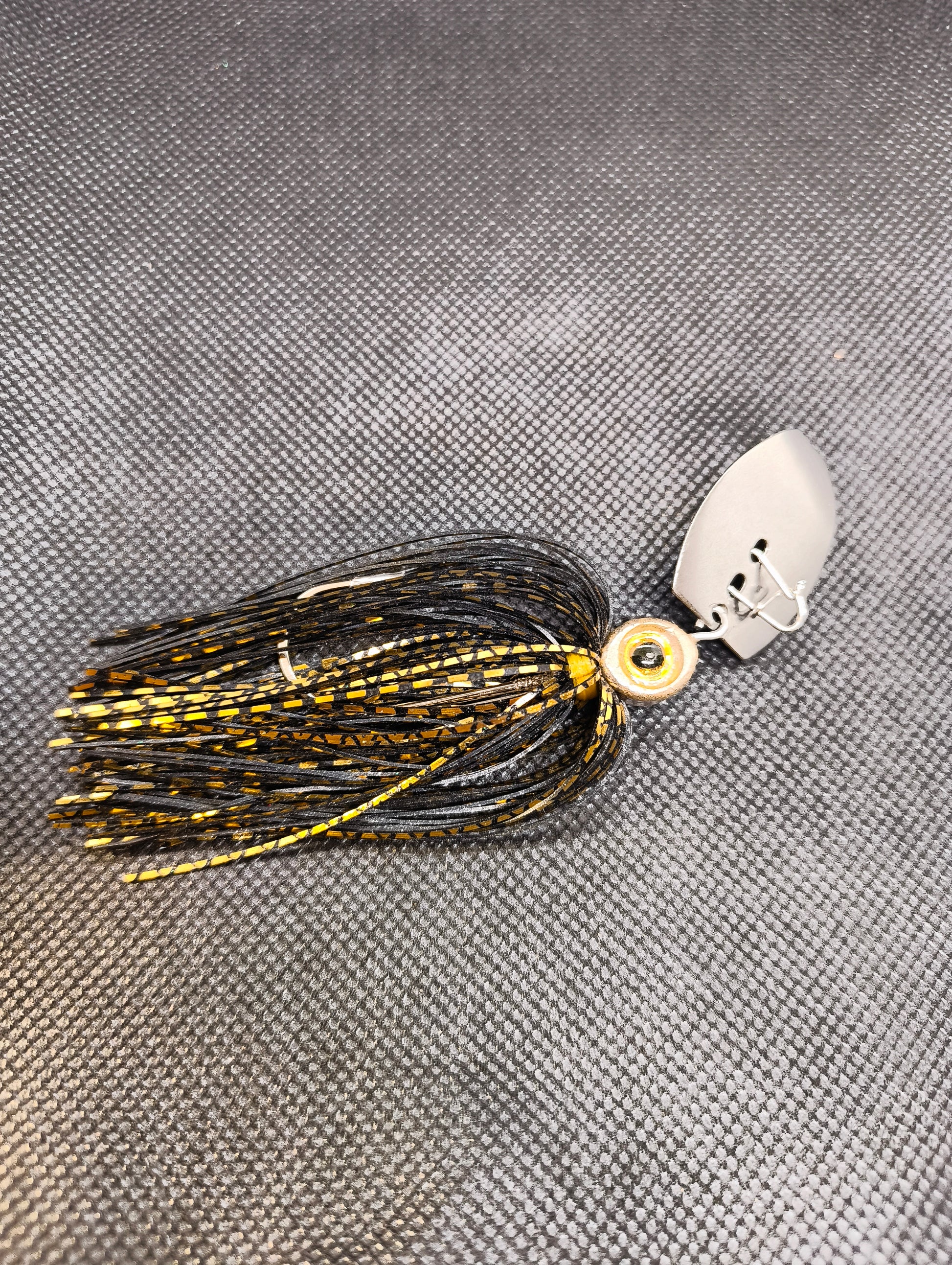 Limestone Softbaits ShadShaker chatterbait with green and black design, featuring a fitted jig head and skirt for bass fishing.