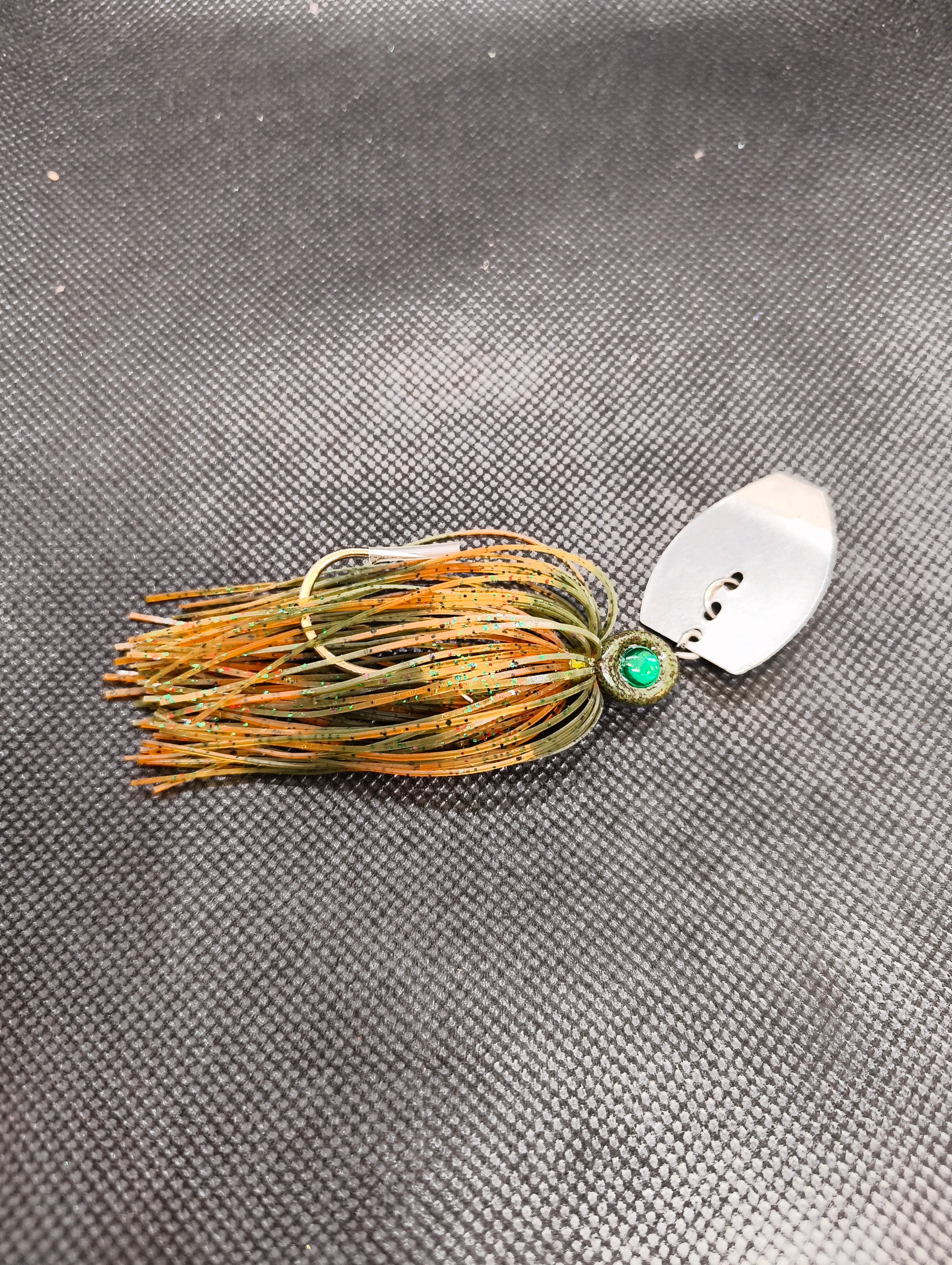 Limestone Softbaits ShadShaker chatterbait with a sleek blade and soft plastic shad for bass fishing, displayed on a white background.