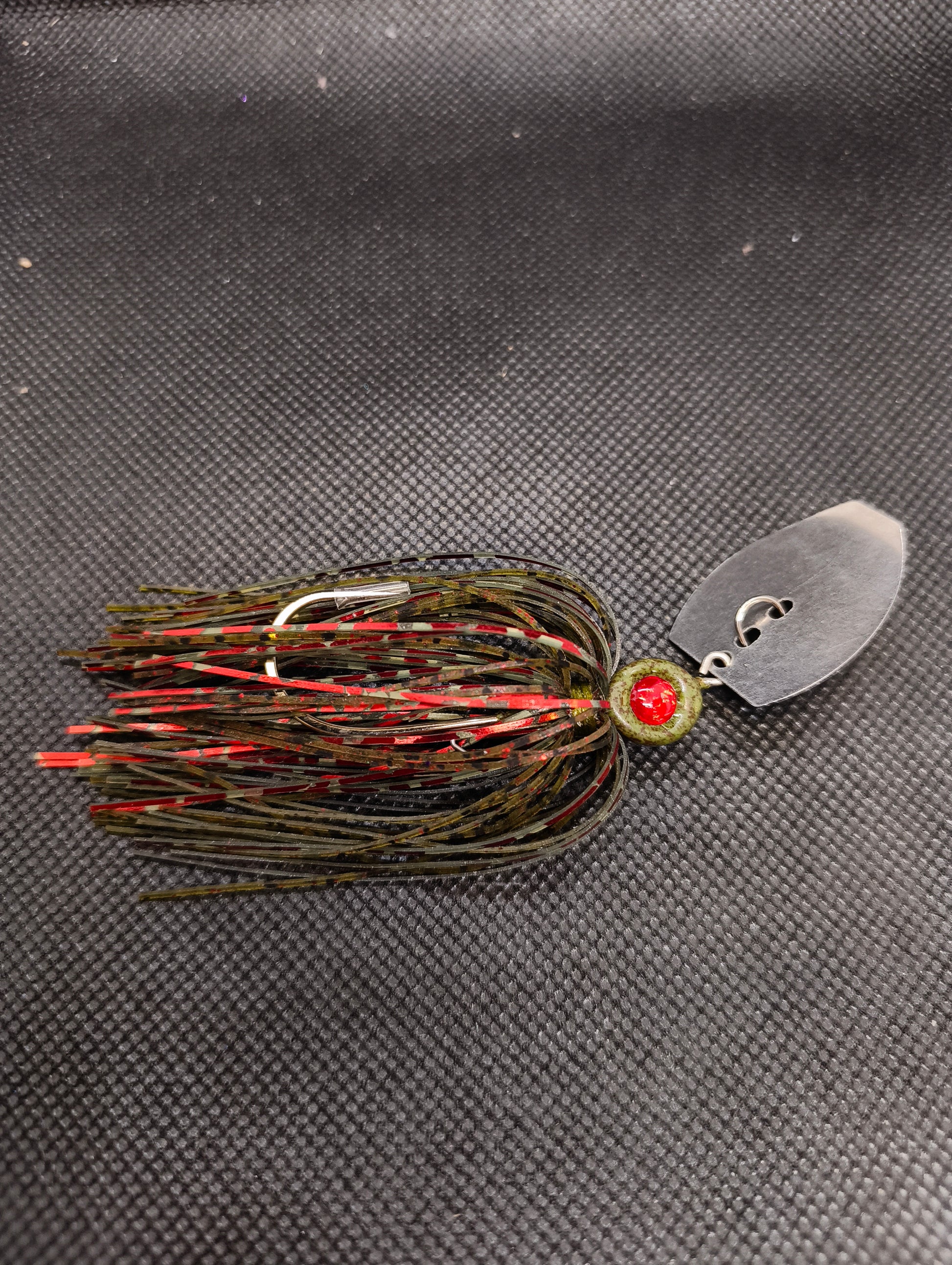 Limestone Softbaits ShadShaker chatter bait with a black and blue jig head and soft plastic shad trailer, ready for fishing.
