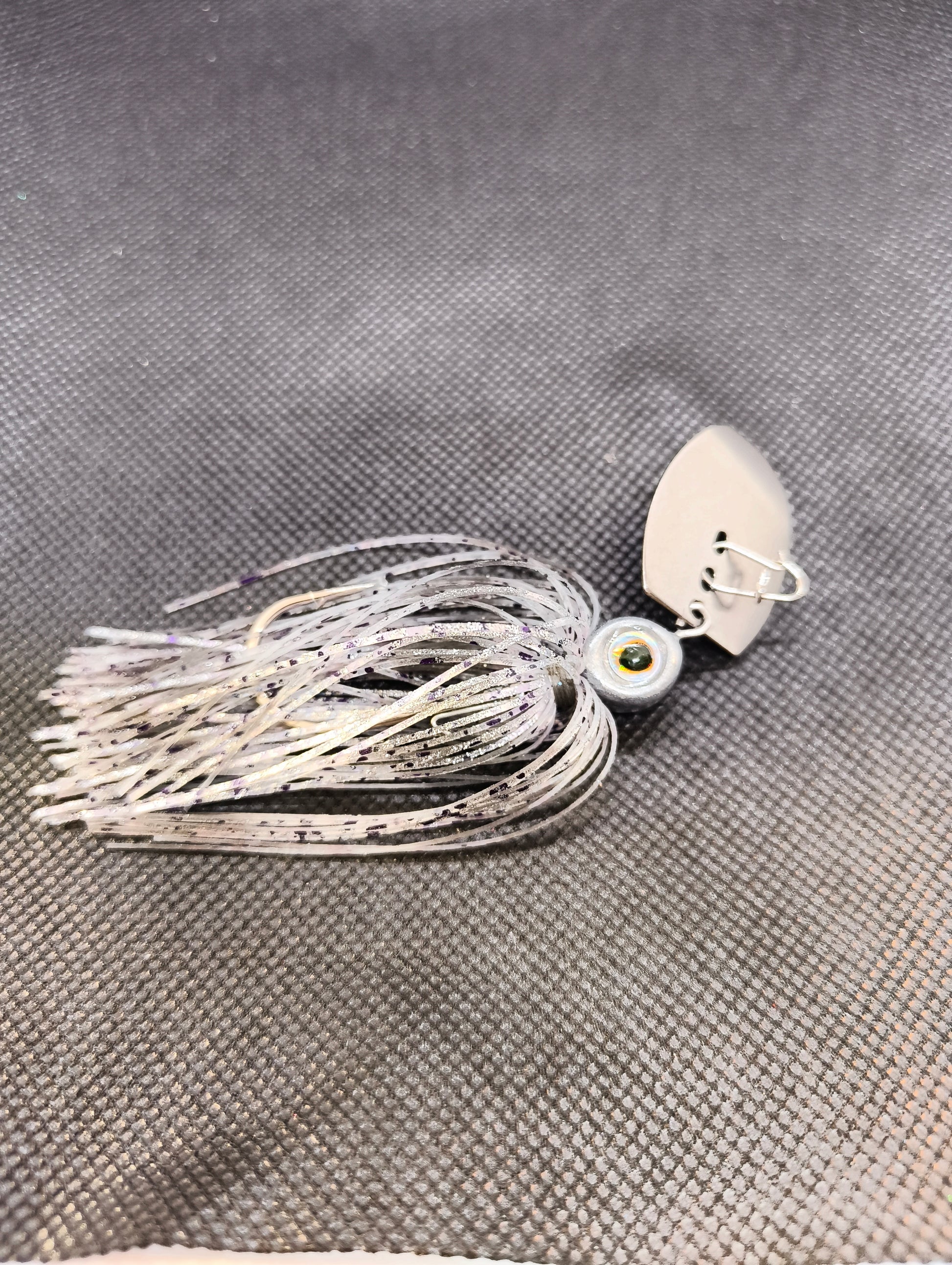 Limestone Softbaits ShadShaker chatter bait with a sleek blade and soft plastic shad body, ideal for fishing lure presentations.