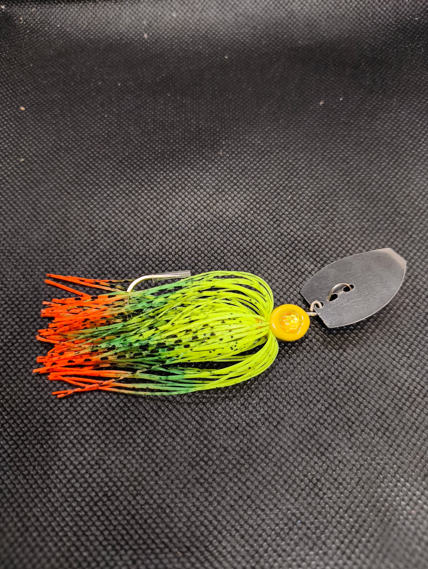 Limestone Softbaits ShadShaker chatter bait with blue and silver accents, designed for freshwater fishing, close-up view of lure details