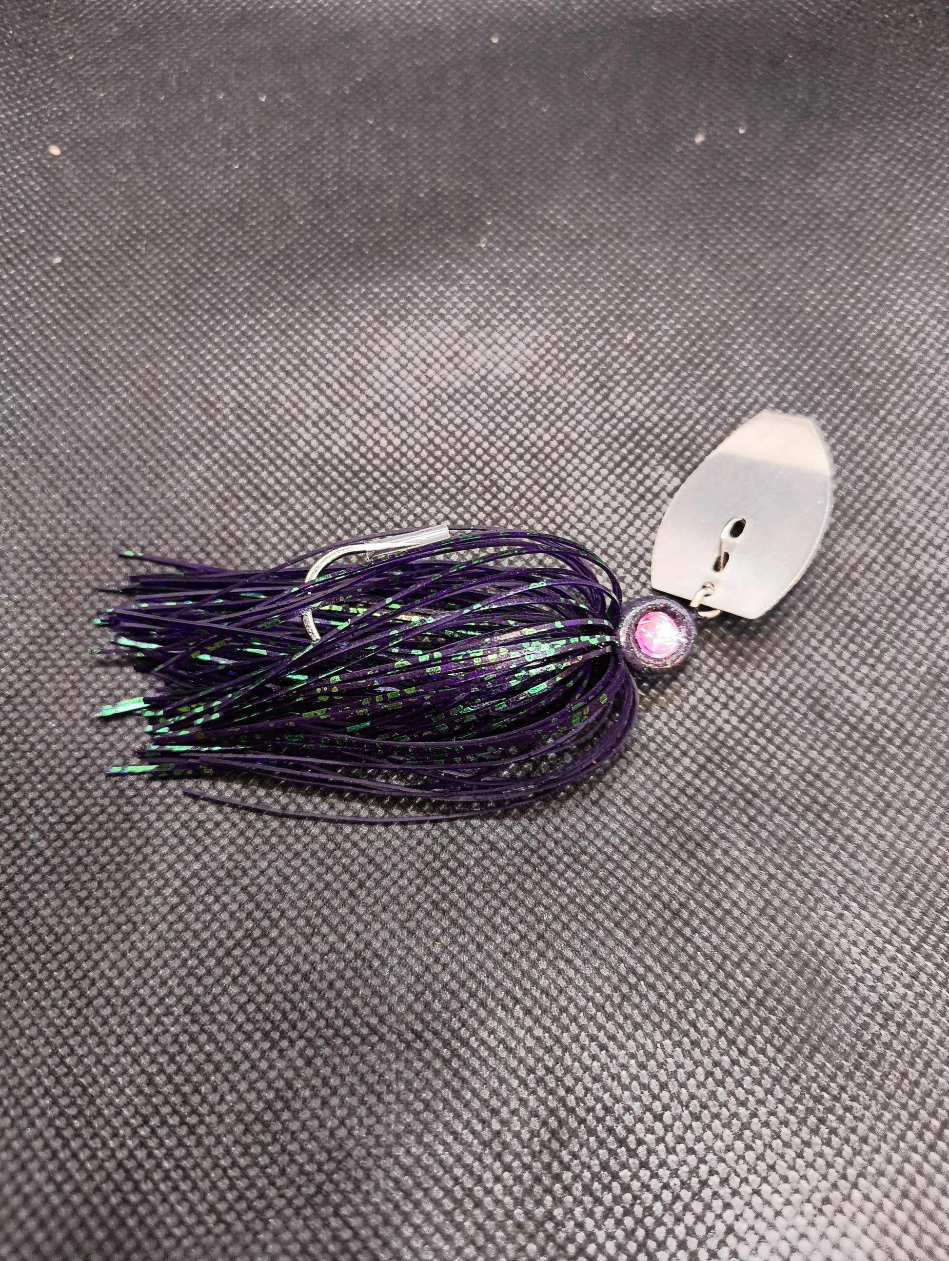 Limestone Softbaits ShadShaker chatter bait with a black and blue soft plastic shad lure attached to a fishing jig head.