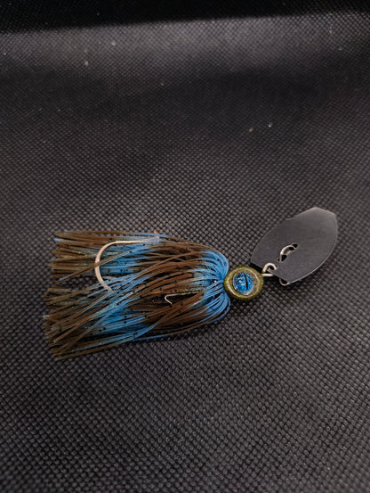 Limestone Softbaits ShadShaker chatter bait with black and blue skirt and metal blade, designed for bass fishing.