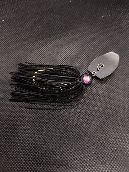Limestone Softbaits ShadShaker chatter bait with a green and black skirt and metal blade for bass fishing.