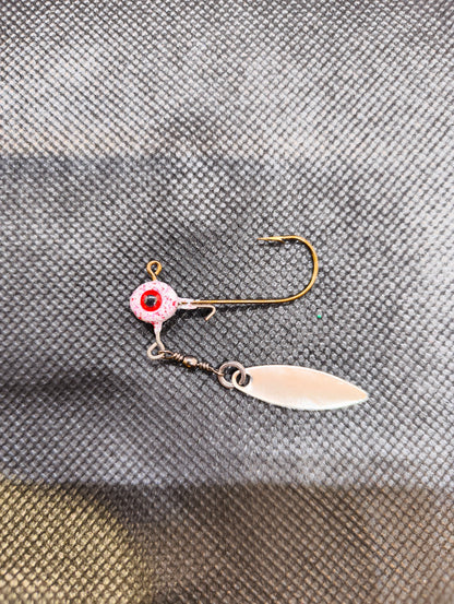 Limestone Softbaits Jiggskalle underspin lure with soft plastic body and spinning blade for fishing, shown in close-up view.