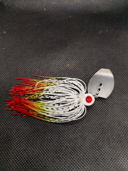 Limestone Softbaits ShadShaker chatterbait with a sleek black and blue soft plastic lure attached to a silver fishing jig head.